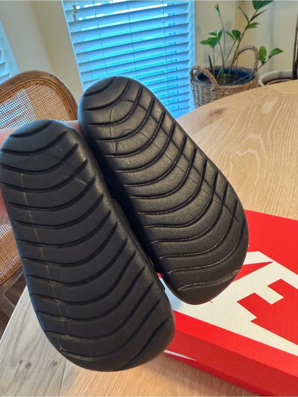 Nike Kids Black Slides with Gold Swoosh and Heel Strap